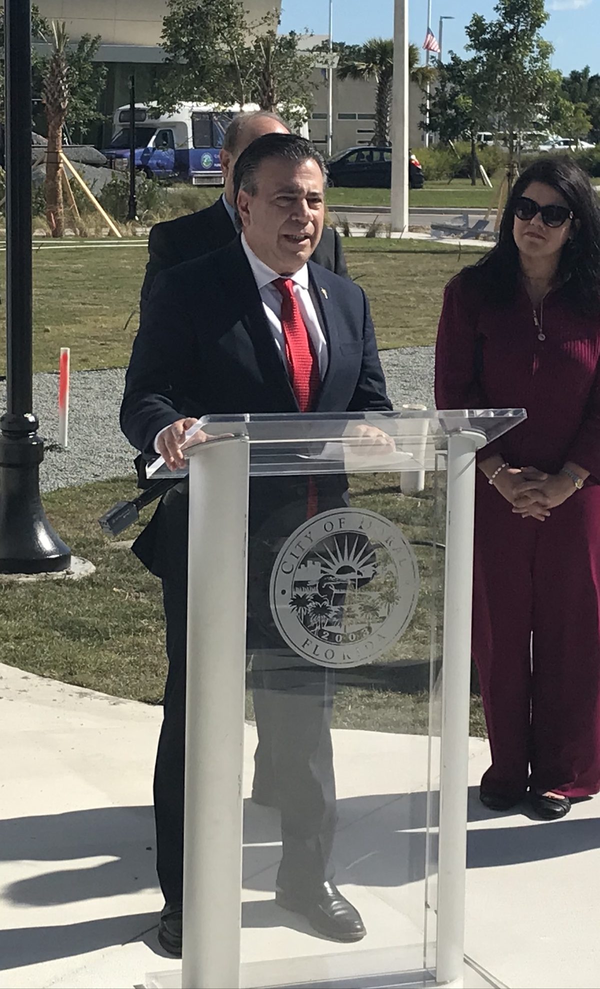George Jalil speaking at a City of Doral podium